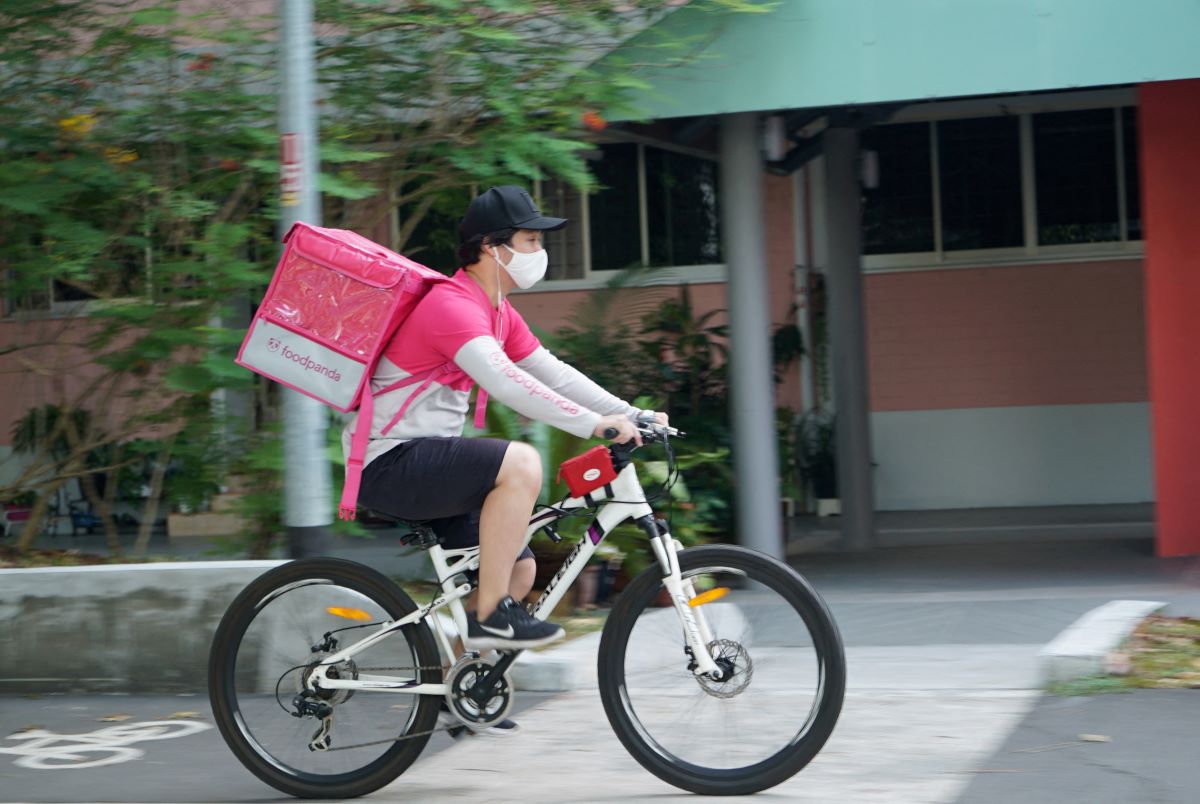 A delivery driver makes a food delivery in Singapore March 9, 2021. REUTERS/Joseph Campbell