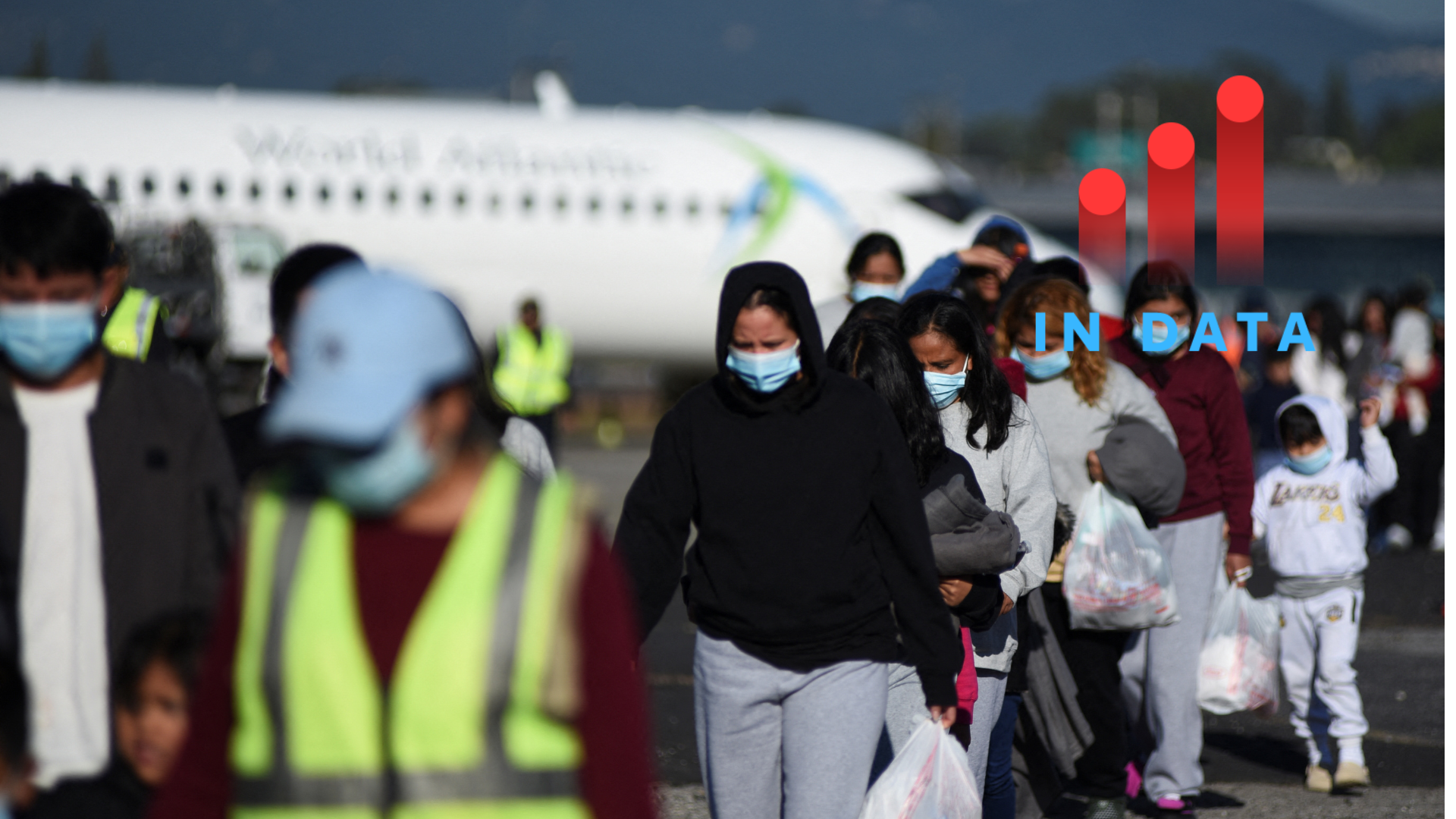 Guatemalan migrants walk after arriving at La Aurora Air Force Base on a deportation flight from the U.S., in Guatemala City, Guatemala, December 27, 2024. REUTERS/Cristina Chiquin