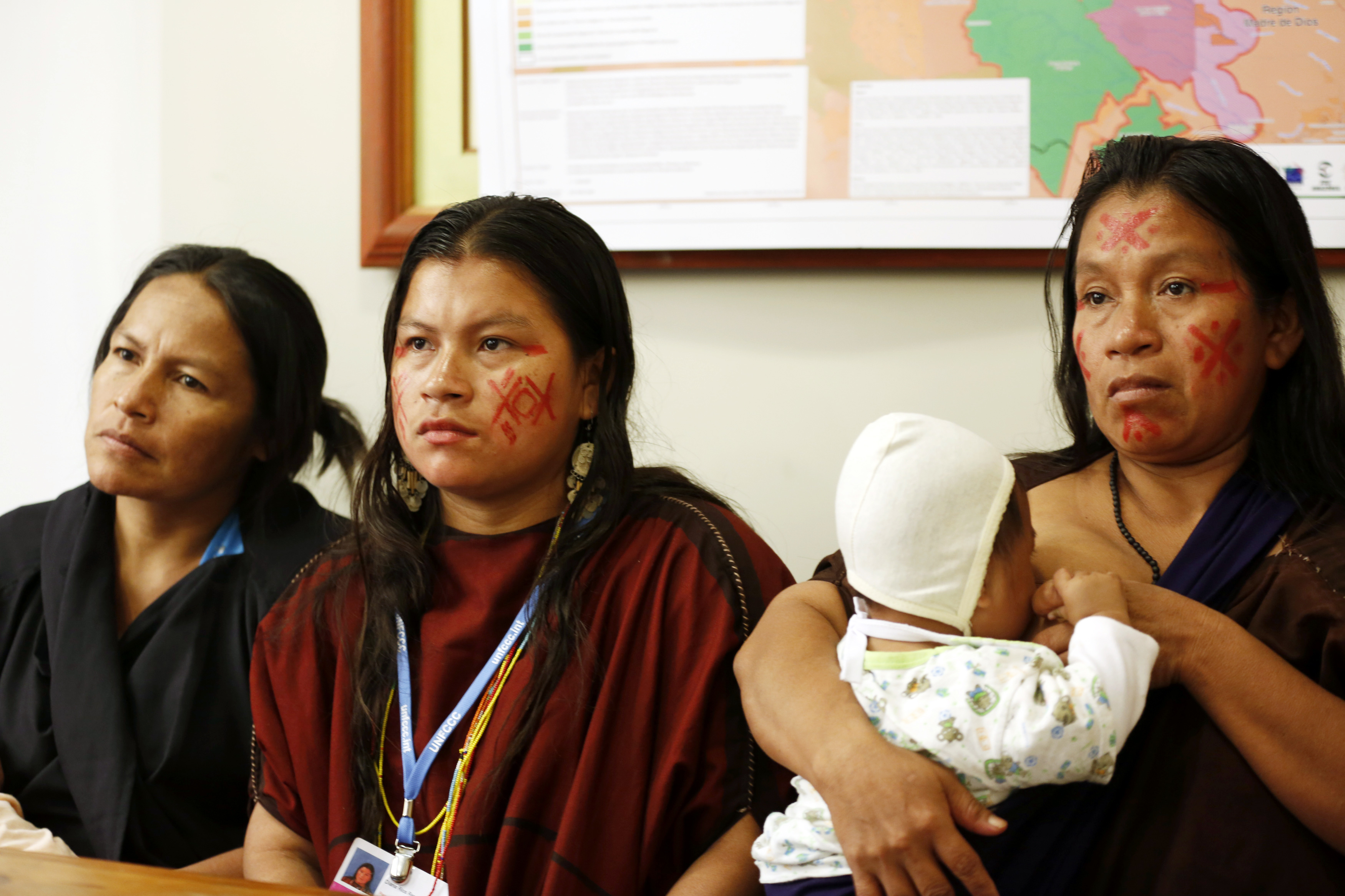 (From L to R) Julia Perez, widow of murdered environmental activist Edwin Chota, Diana Rios and Ergilia Rengifo, daughter and widow of murdered Ashaninka leader Jorge Rios, attend a news conference in Lima, December 3, 2014. REUTERS/Mariana Bazo