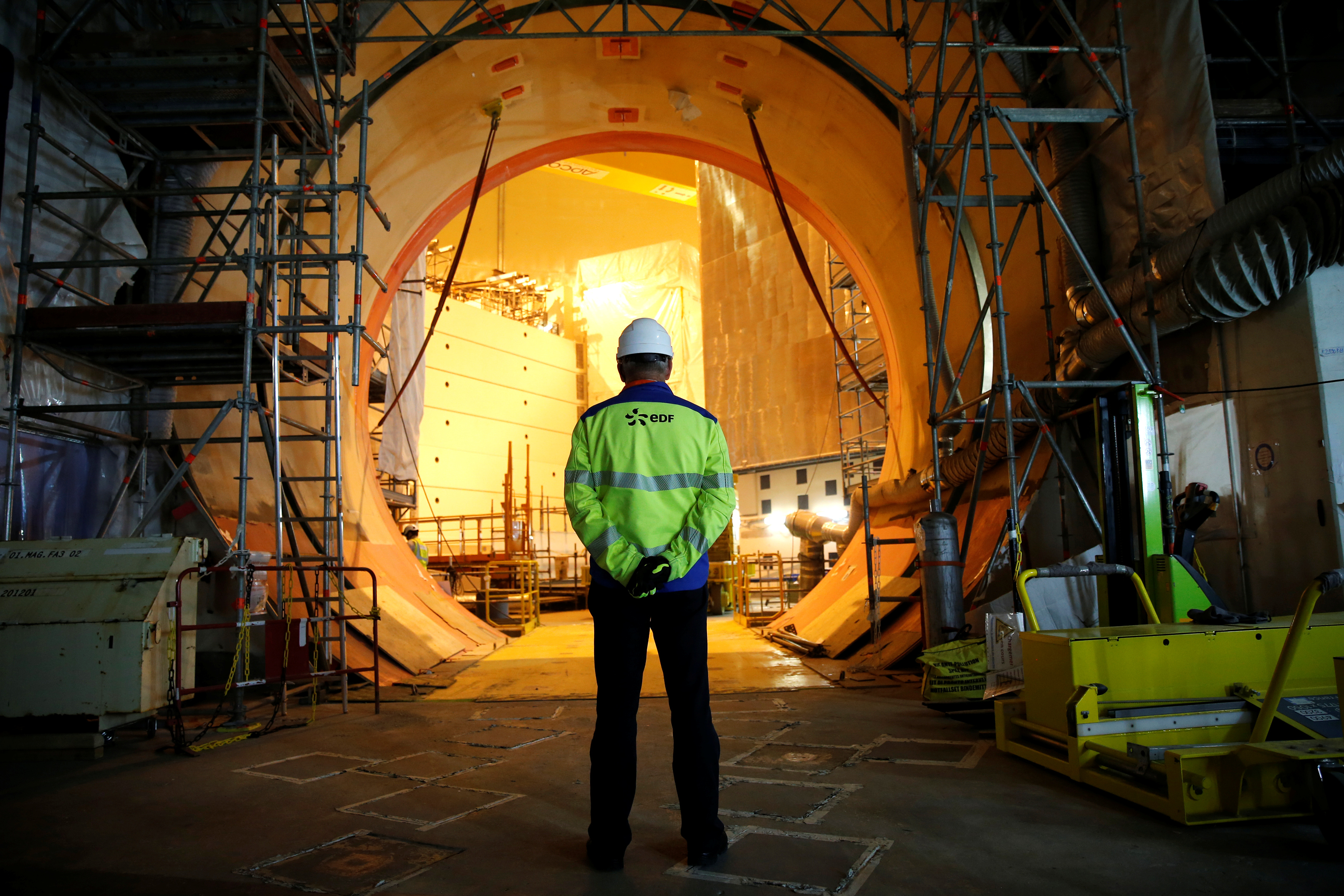 An EDF worker is seen on the construction site of the third-generation European Pressurised Water nuclear reactor (EPR) in Flamanville, France, November 16, 2016. REUTERS/Benoit Tessier