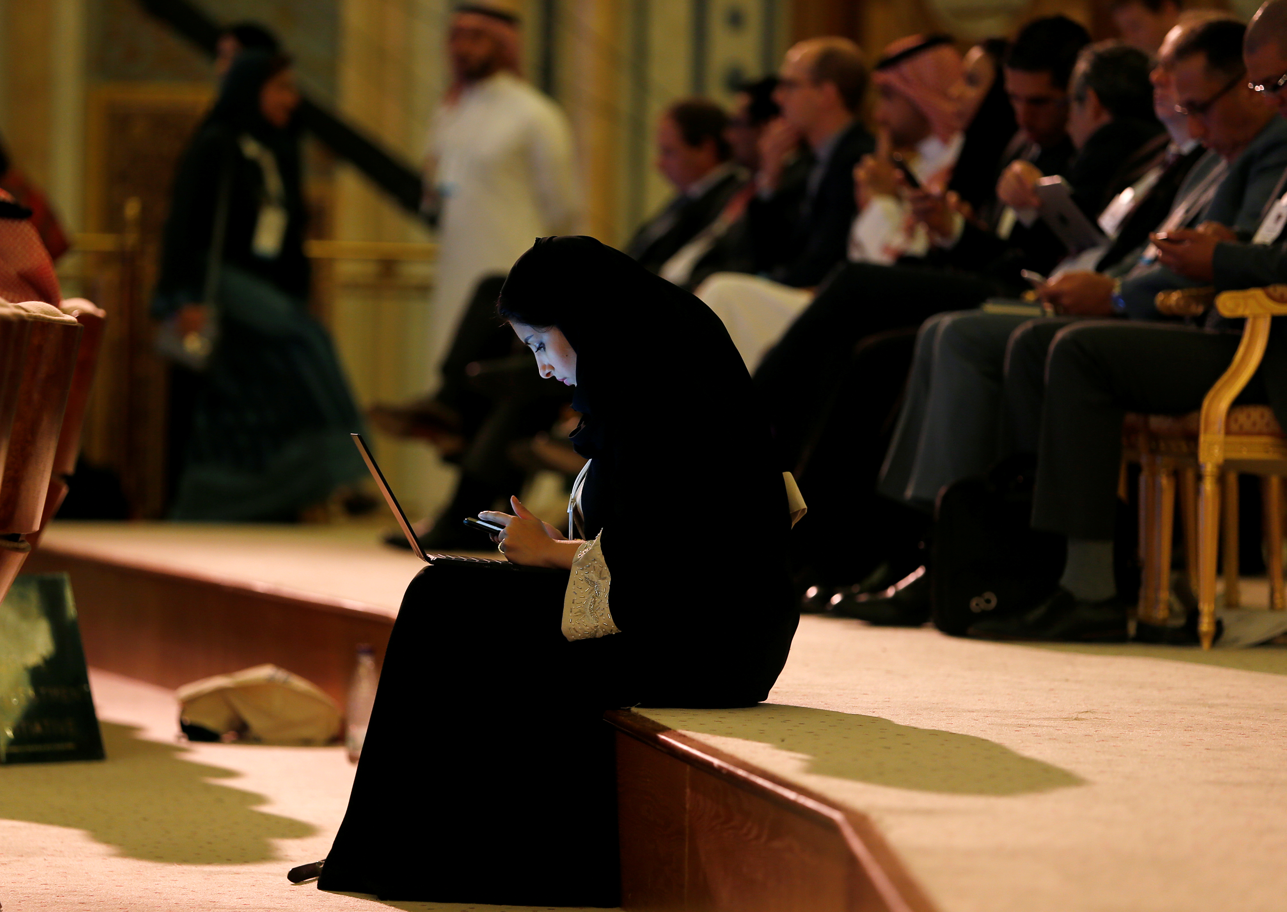 A woman uses her laptop in Riyadh, Saudi Arabia October 24, 2017. REUTERS/Hamad I Mohammed