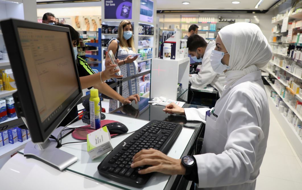 Pharmacy employees serve customers in Beirut, Lebanon May 28, 2021.REUTERS/Mohamed Azakir