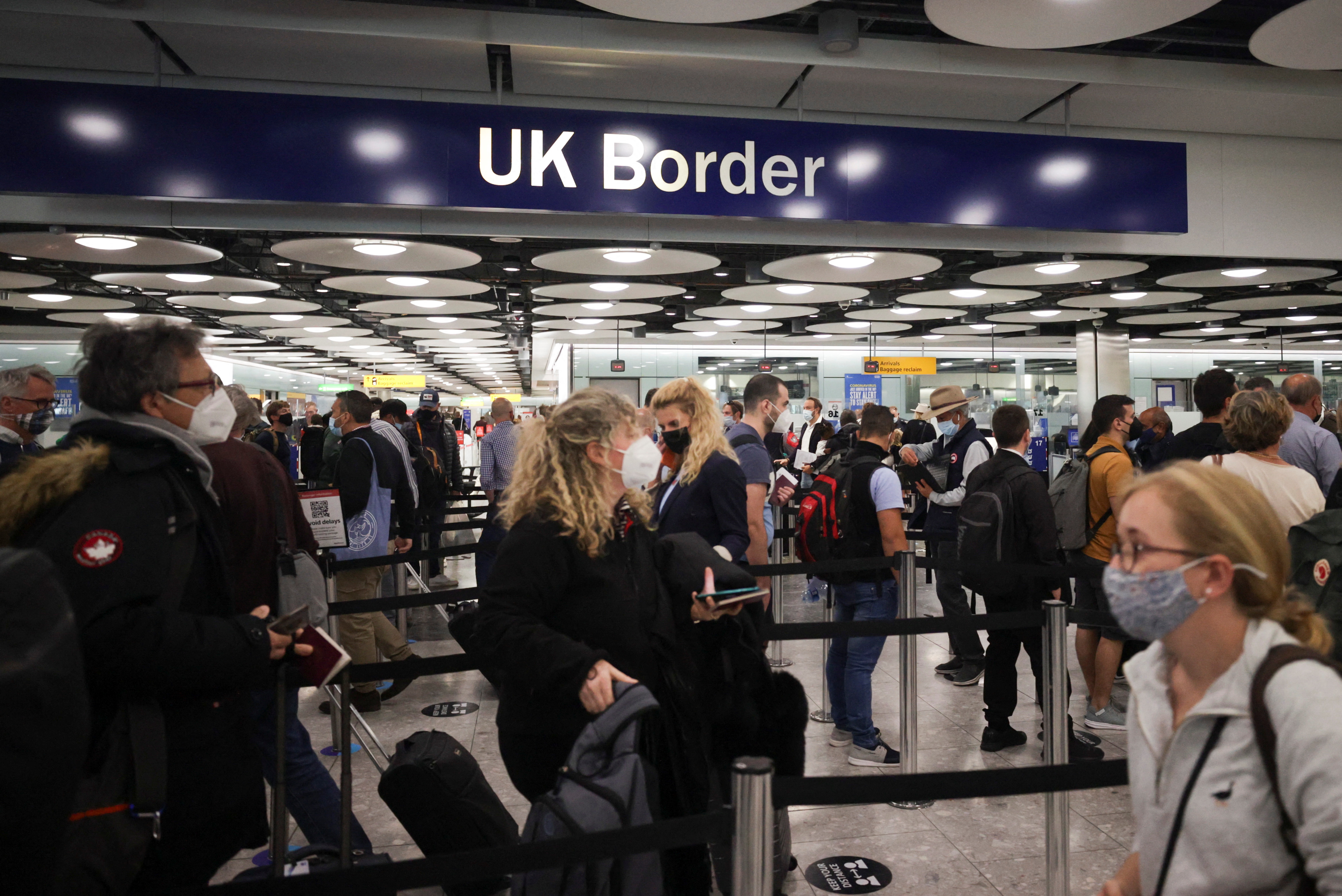 Arriving passengers queue at UK Border Control at the Terminal 5 at Heathrow Airport in London, Britain June 29, 2021. REUTERS/Hannah Mckay