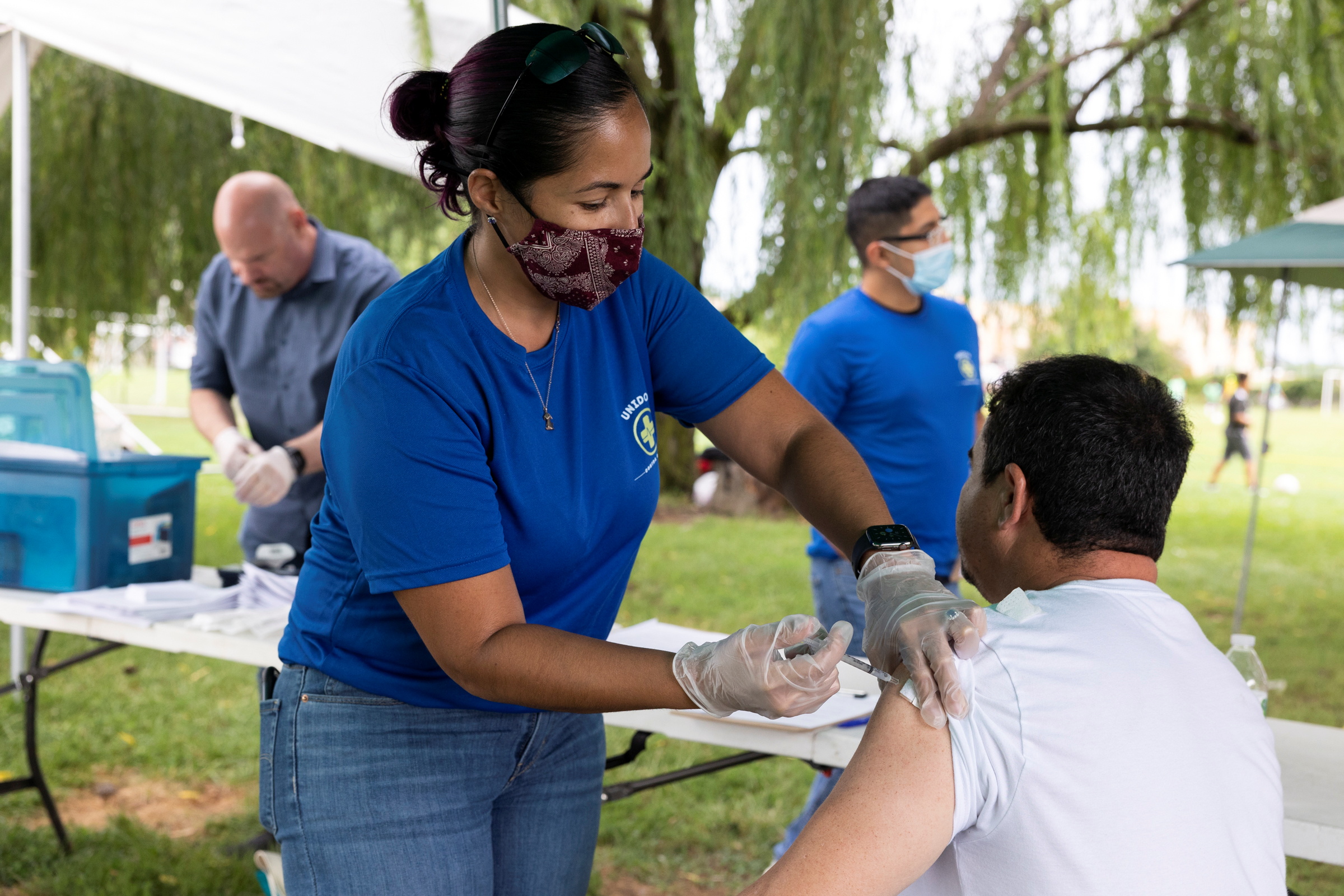 Doctor administers COVID-19 vaccinations to members of the Latino community during an outreach event in Bensalem, Pennsylvania, U.S., August 22, 2021. REUTERS/Rachel Wisniewski