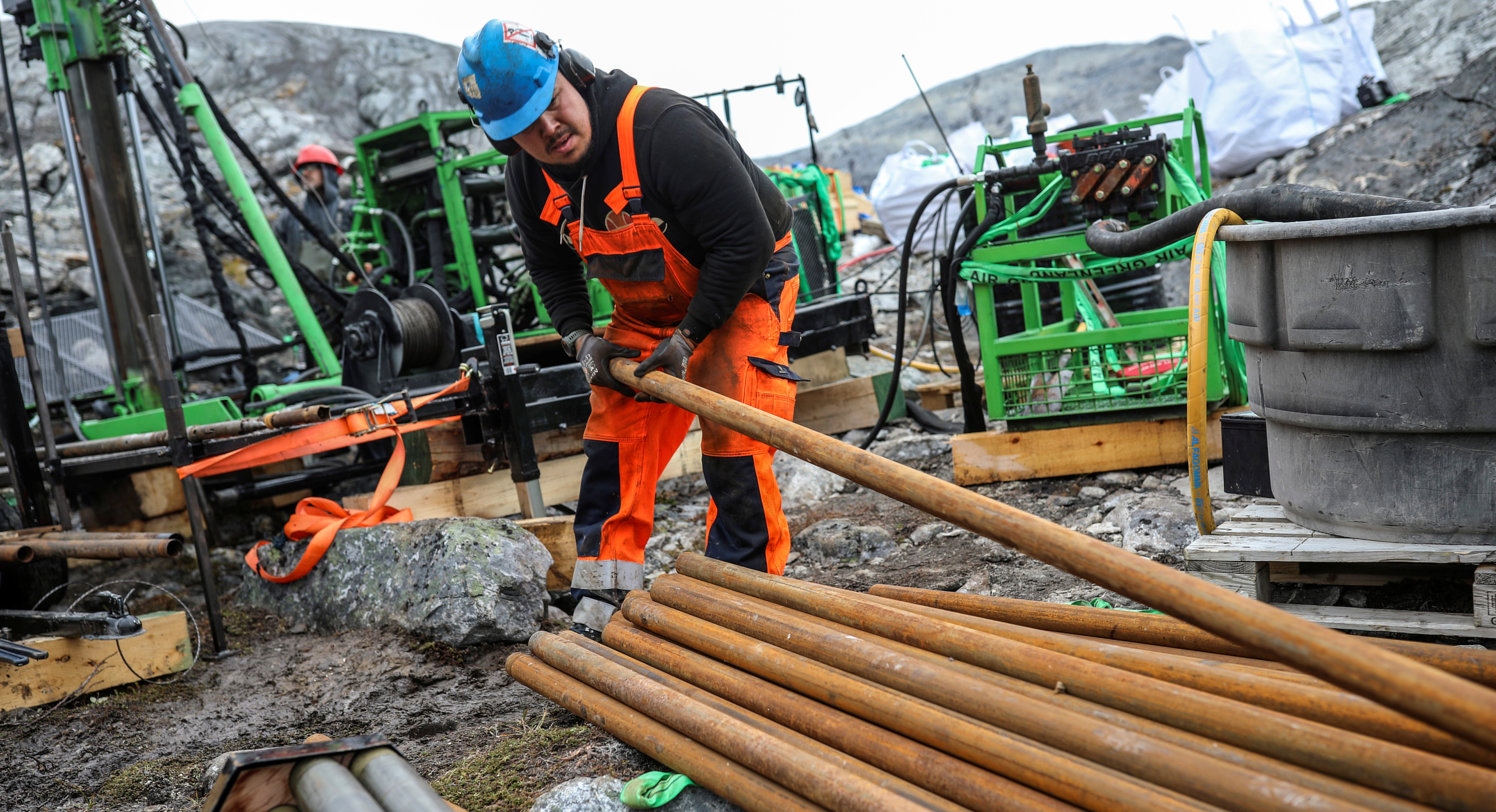 Workers of the company Greenland Anorthosite Mining drill at an exploration site at the Qeqertarsuatsiaat fjord, Greenland, September 11, 2021. REUTERS/Hannibal Hanschke