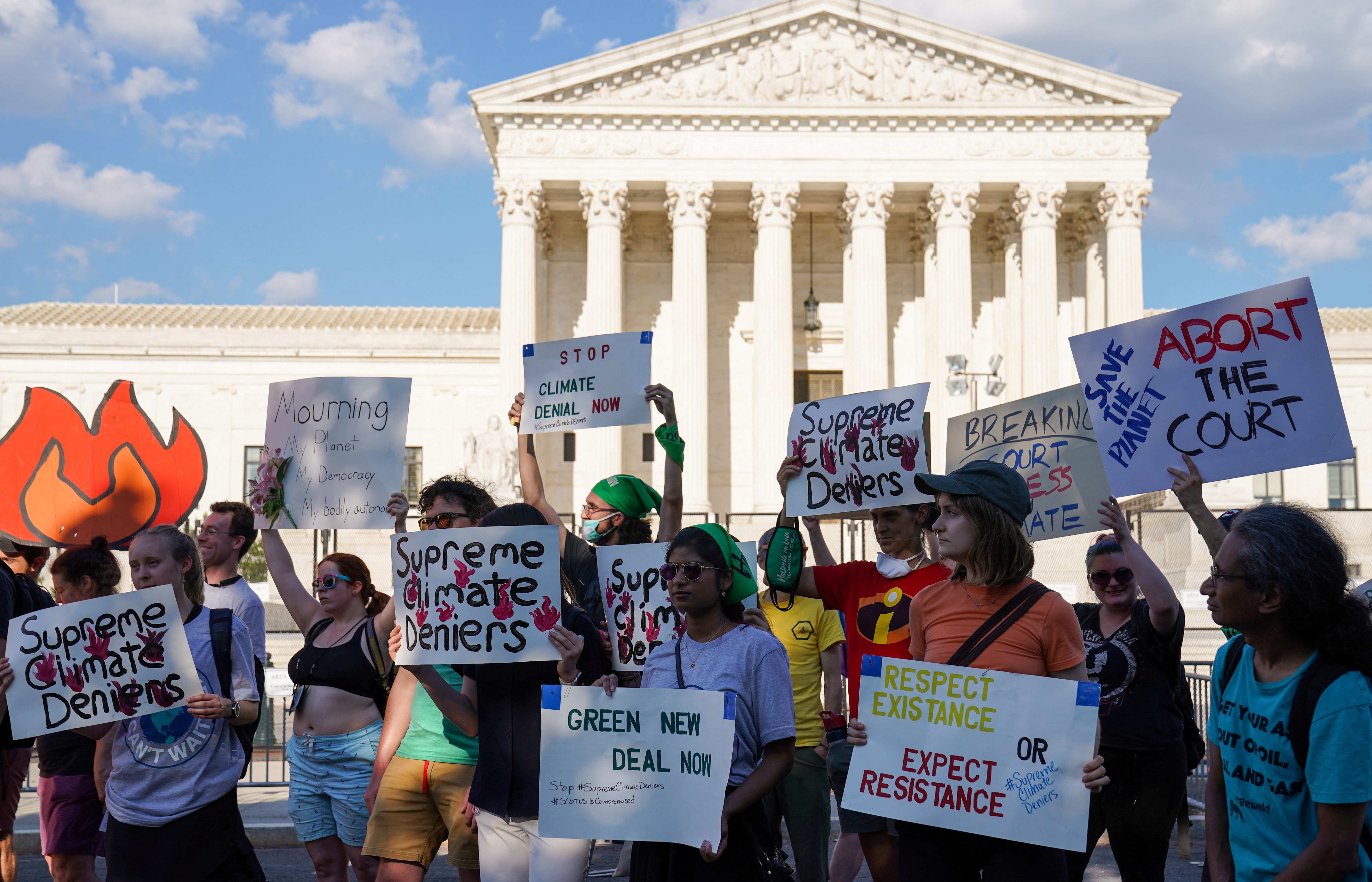 Climate activists participate in a demonstration following the West Virginia v. Environmental Protection Agency ruling outside of the U.S. Supreme Court in Washington, D.C., U.S., June 30, 2022. REUTERS/Sarah Silbiger