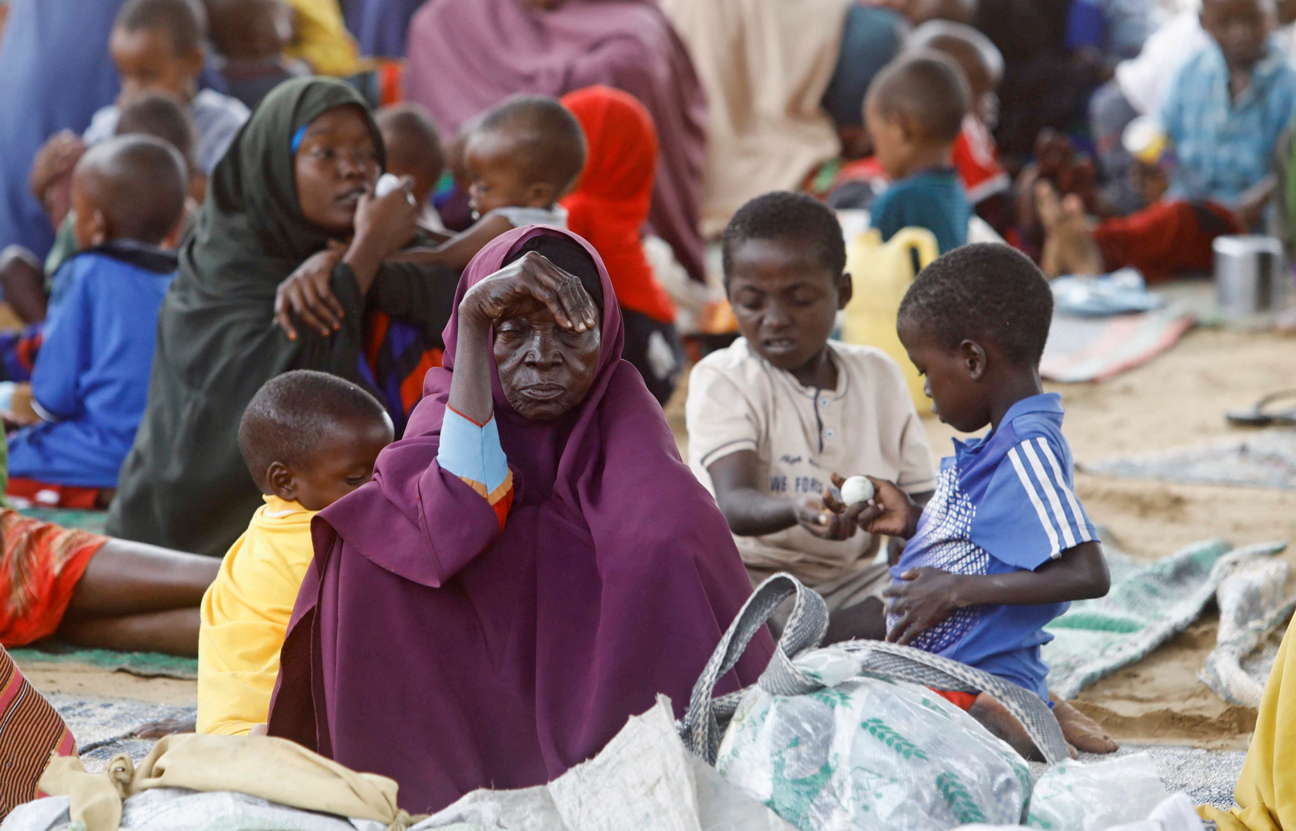 People affected by the worsening drought due to failed rain seasons, gather at the Alla Futo camp for internally displaced people, in the outskirts of Mogadishu, Somalia September 23, 2022. REUTERS/Feisal Omar