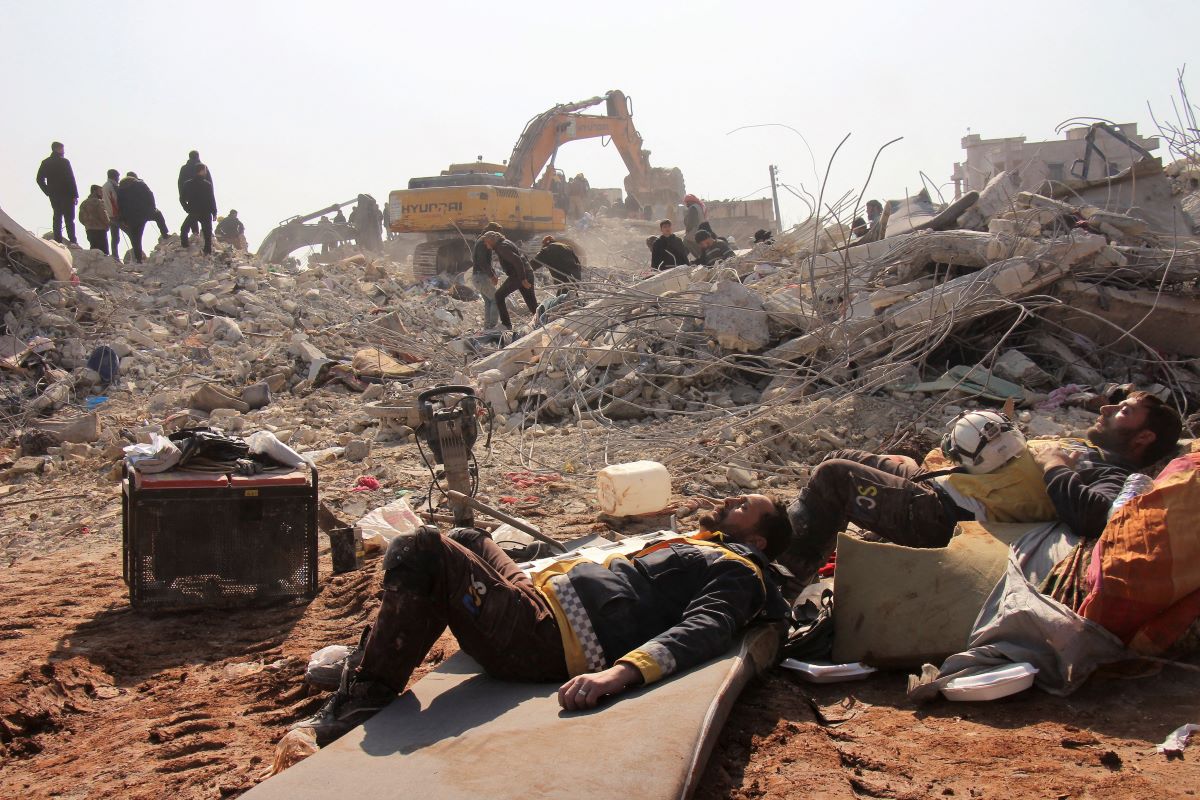 White Helmets members rest on day five of the rescue operations after a massive earthquake in Jandaris, Syria February 10, 2023 in this image obtained from social media. White Helmets via REUTERS