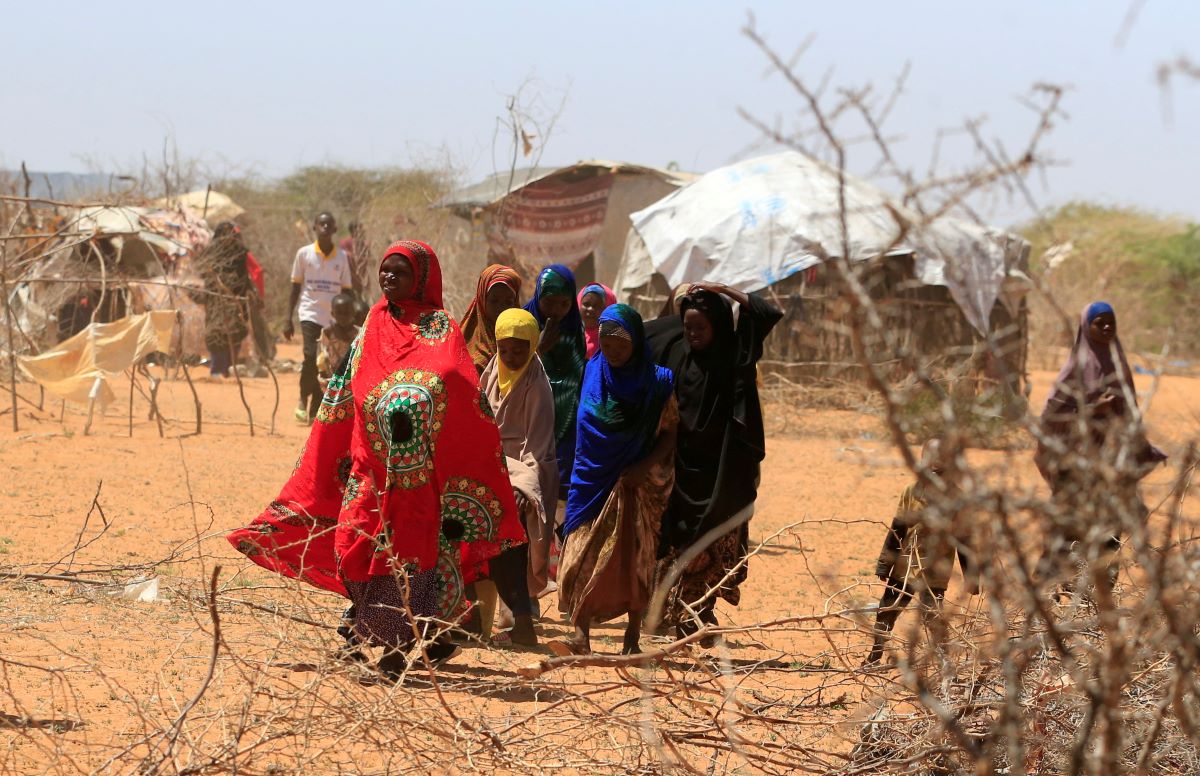 Somali refugees walk outside their makeshift shelters in the new arrivals area at the Hagadera refugee camp in Dadaab, near the Kenya-Somalia border, in Garissa County, Kenya, January 17, 2023. REUTERS/Thomas Mukoya