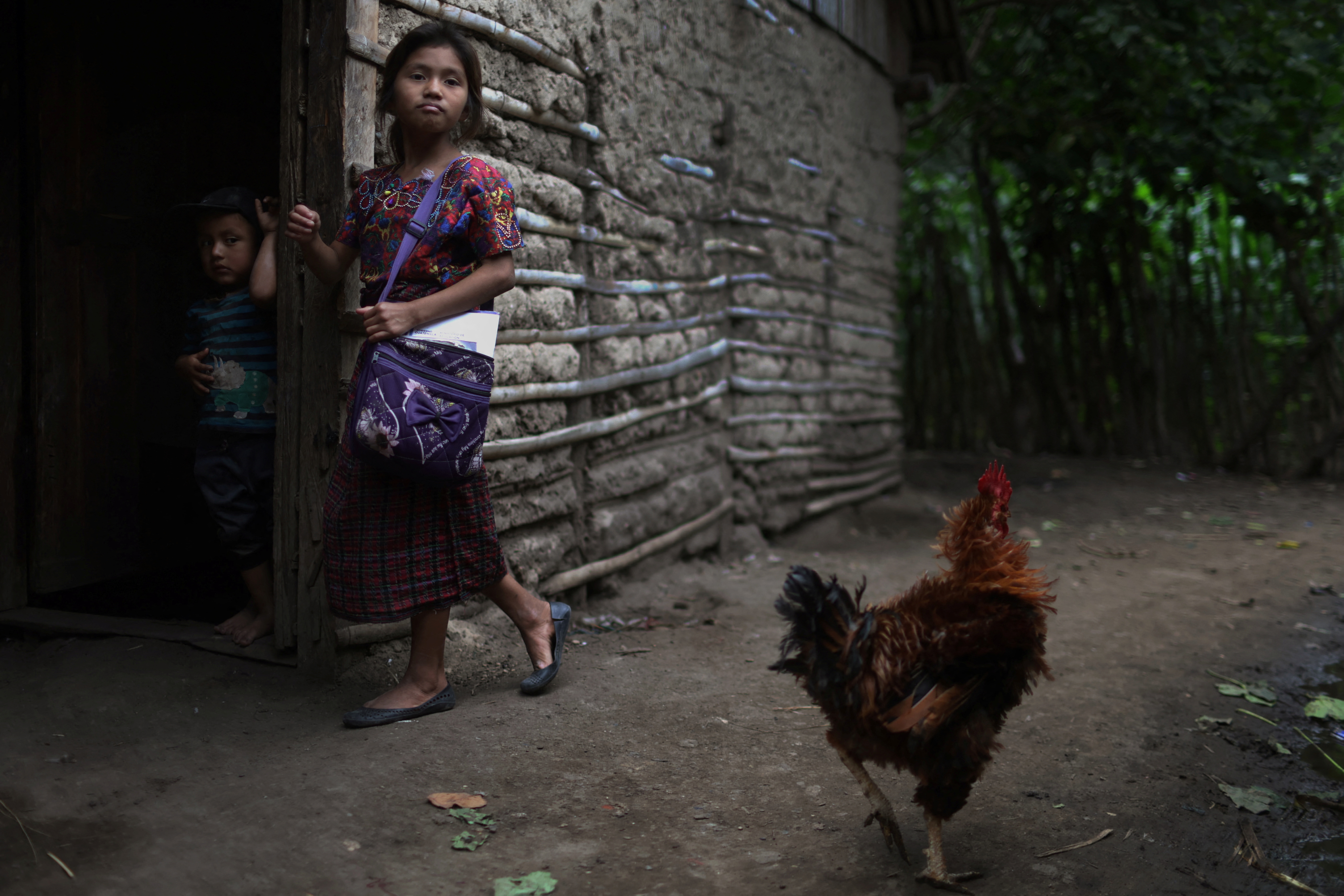 Children arrive home from school to their house in El Aguacate village in Baja Verapaz, Guatemala August 16, 2023. REUTERS/Pilar Olivares