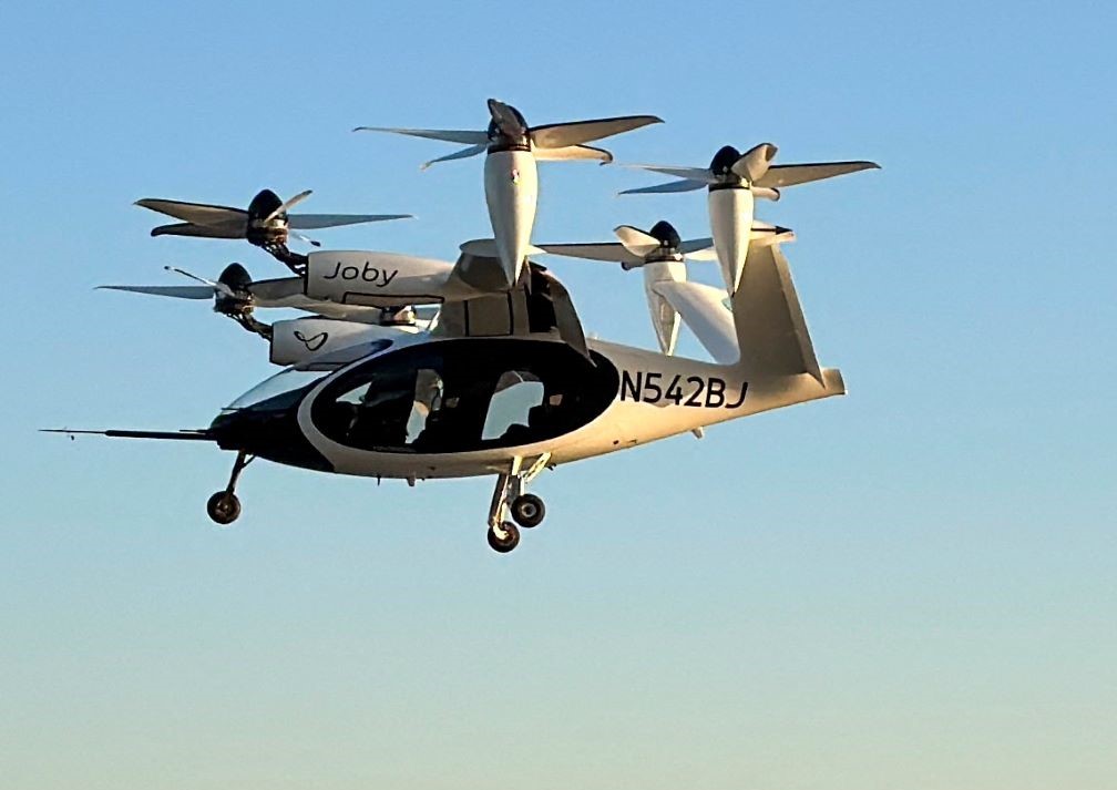 An electric air taxi by Joby Aviation flies near the Downtown Manhattan Heliport in Manhattan, New York City, U.S., November 12, 2023. REUTERS/Roselle Chen