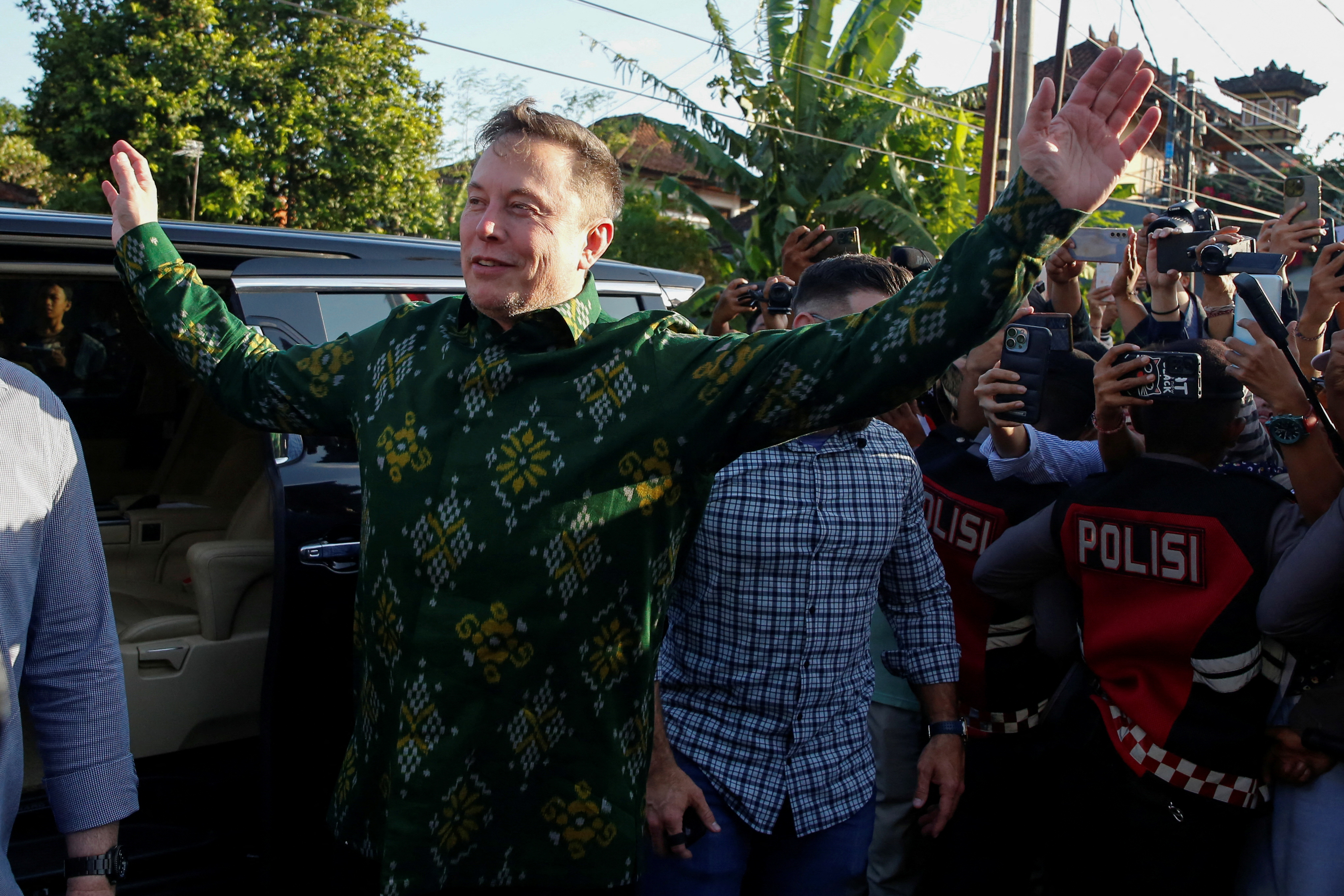 Elon Musk, chief executive officer of SpaceX and Tesla, greets the media as he arrives to launch SpaceX's Starlink internet service in Indonesia at a sub district community health center in Denpasar, Bali, May 19, 2024. REUTERS/Johannes P. Christo