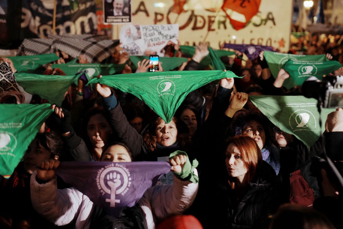 Women hold green handkerchiefs, symbolizing the abortion rights movement, to protest against violence towards women outside the National Congress, in Buenos Aires, Argentina June 3, 2024. REUTERS/Irina Dambrauskas