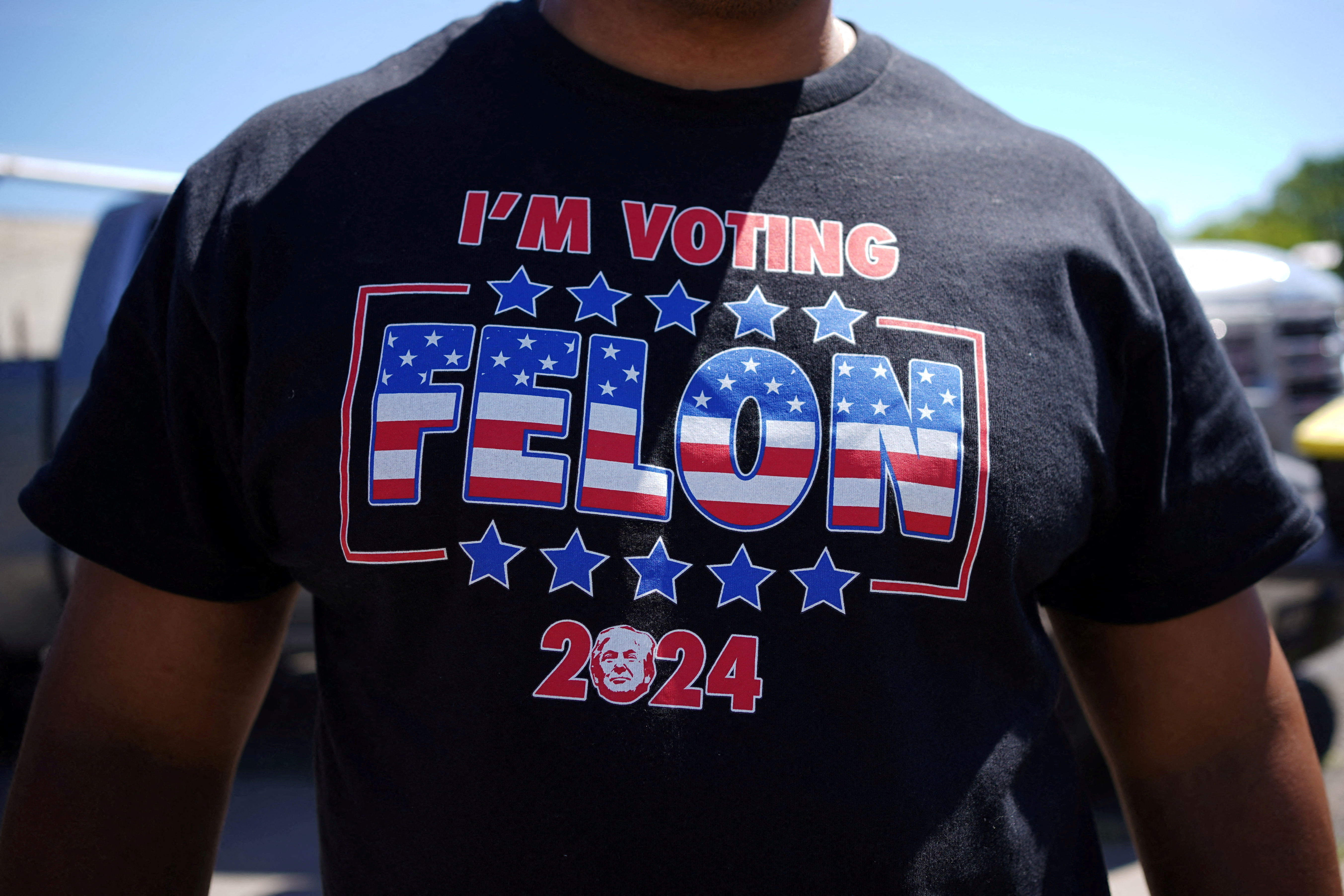 A supporter wears a t-shirt reading "I'm Voting Felon" before a campaign community roundtable with Republican presidential candidate and former U.S. President Donald Trump at 180 Church in Detroit, Michigan, U.S., June 15, 2024. REUTERS/Brian Snyder