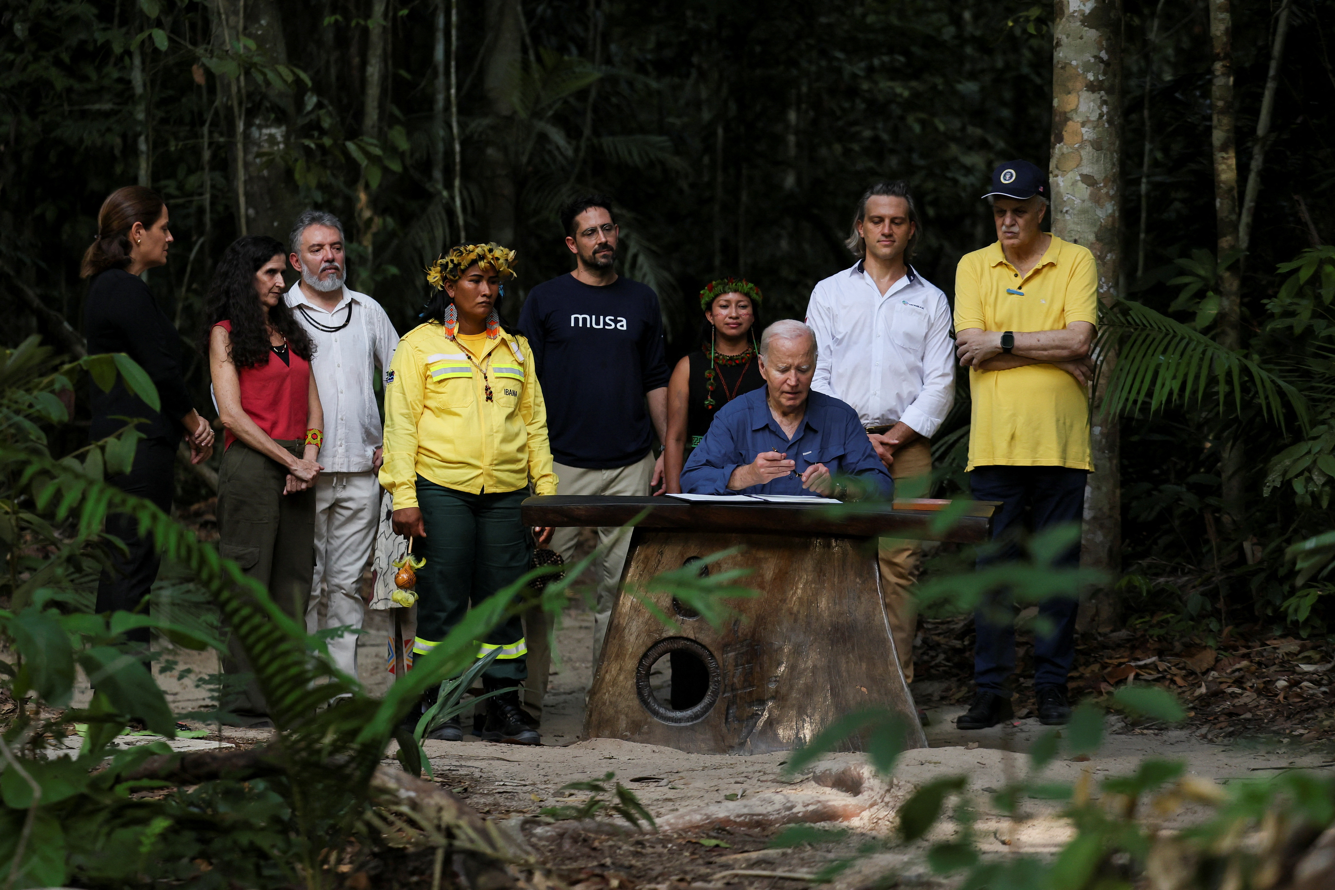 Carlos Nobre poses alongside climate leaders as U.S. President Joe Biden signs a proclamation designating November 17 as "International Conservation Day", in Manaus, Brazil, November 17, 2024. REUTERS/Leah Millis