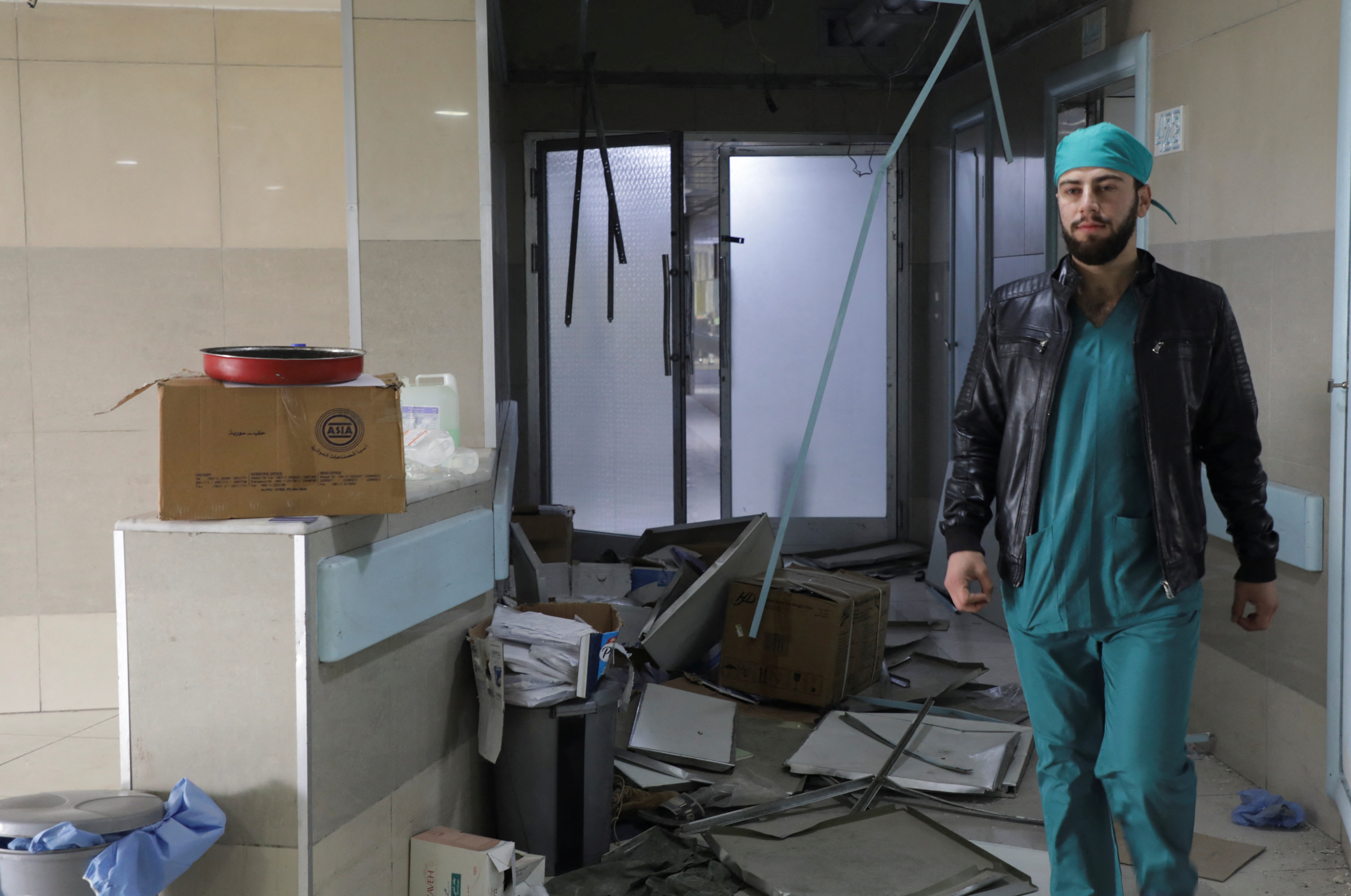 A medical worker walks inside the Aleppo University Hospital that is damaged by strikes, after rebels have staged a whirlwind advance over the past week, seizing Aleppo and much of the surrounding countryside, in Syria December 4, 2024. REUTERS/Mahmoud Hasano