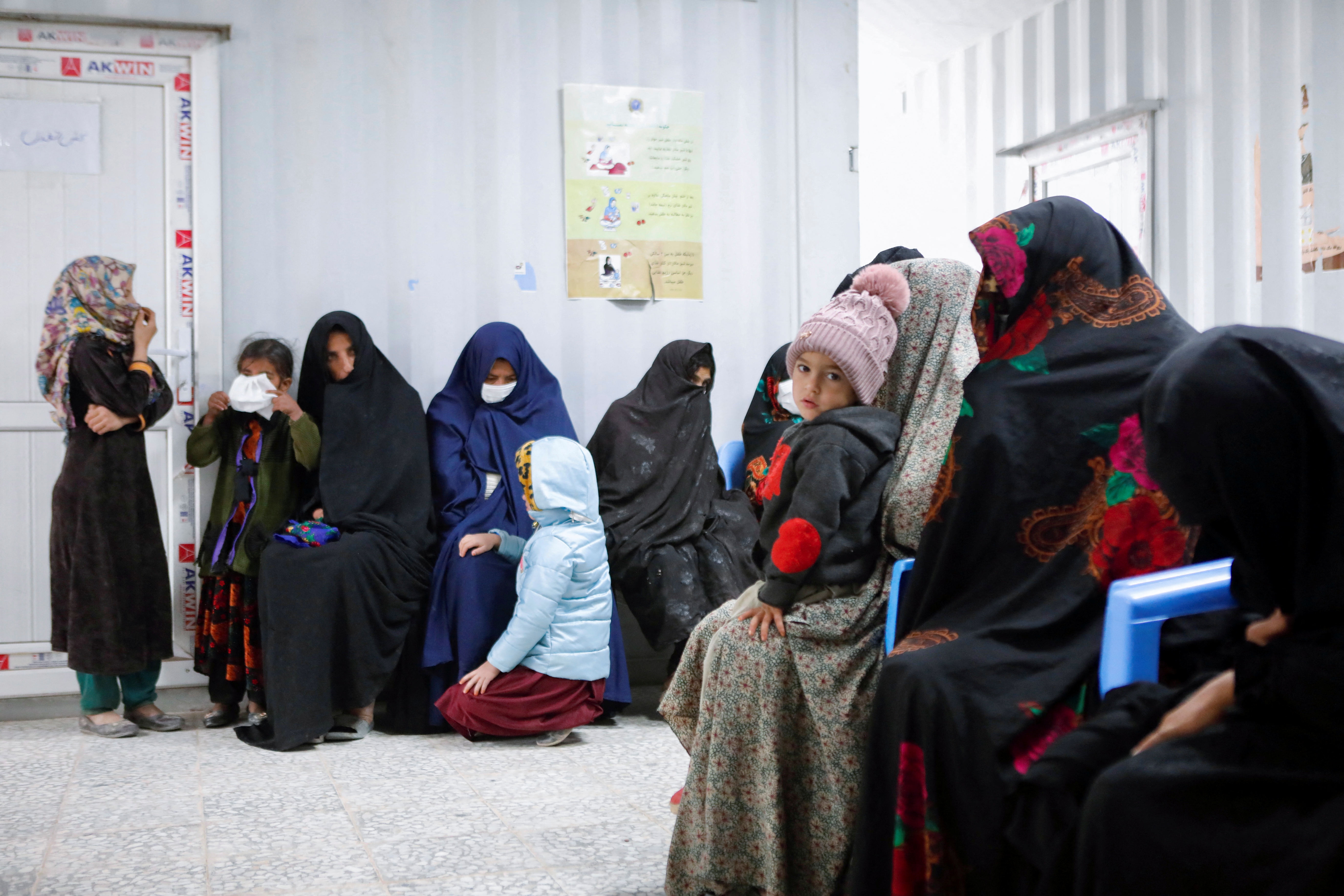 Afghan women and children wait for their turn to see a doctor at Yaka Dokan health clinic run by nonprofit organization World Vision, in Yaka Dokan village, Herat, Afghanistan, October 23, 2024. REUTERS/Sayed Hassib