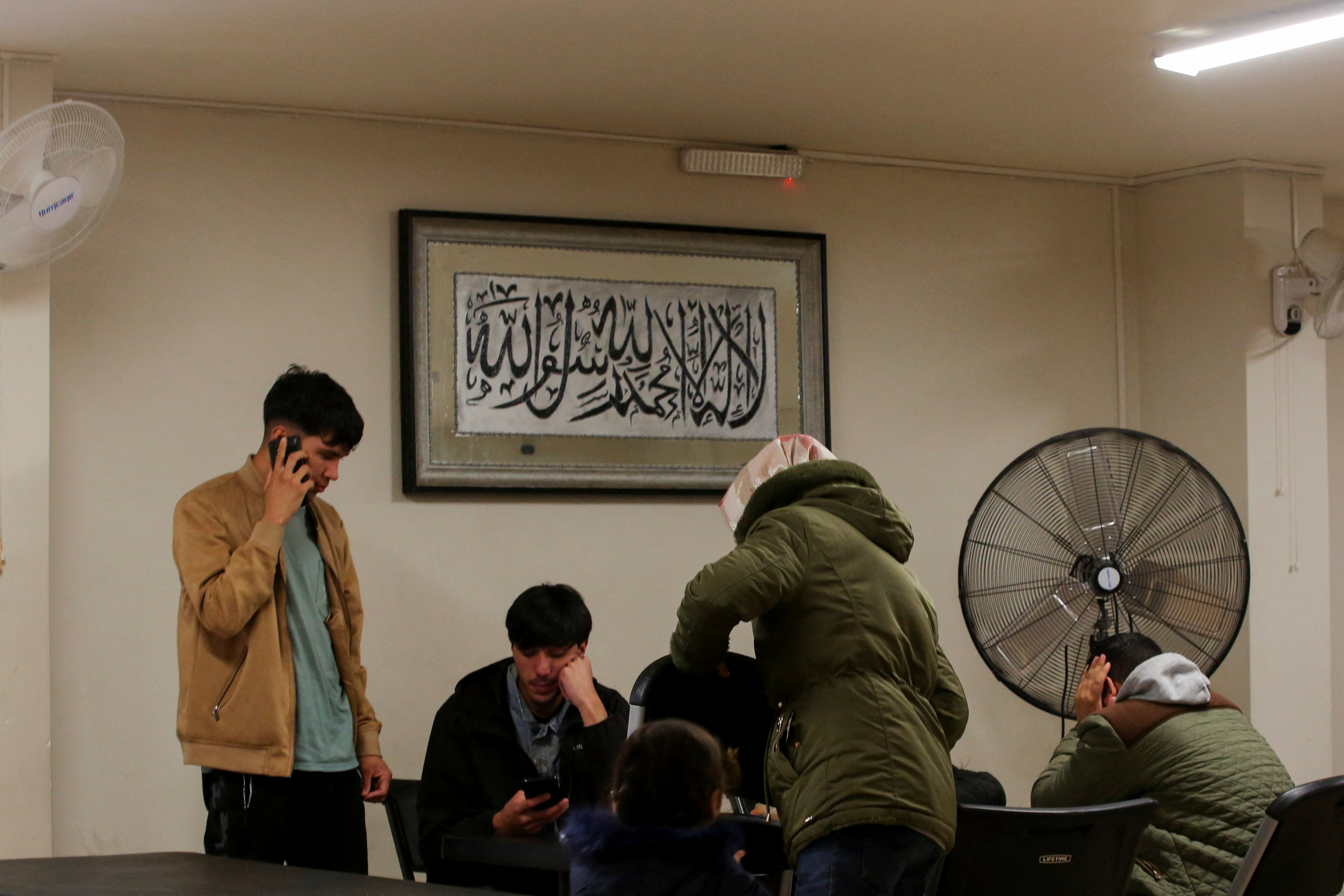 Muslim migrants stranded in Mexico after U.S. President Donald Trump cancelled all U.S. asylum appointments for migrants waiting in Mexico gather at the Assabil shelter, the only such refuge in Mexico specifically for Muslim migrants, in Tijuana, Mexico January 21, 2025. REUTERS/Jorge Duenes