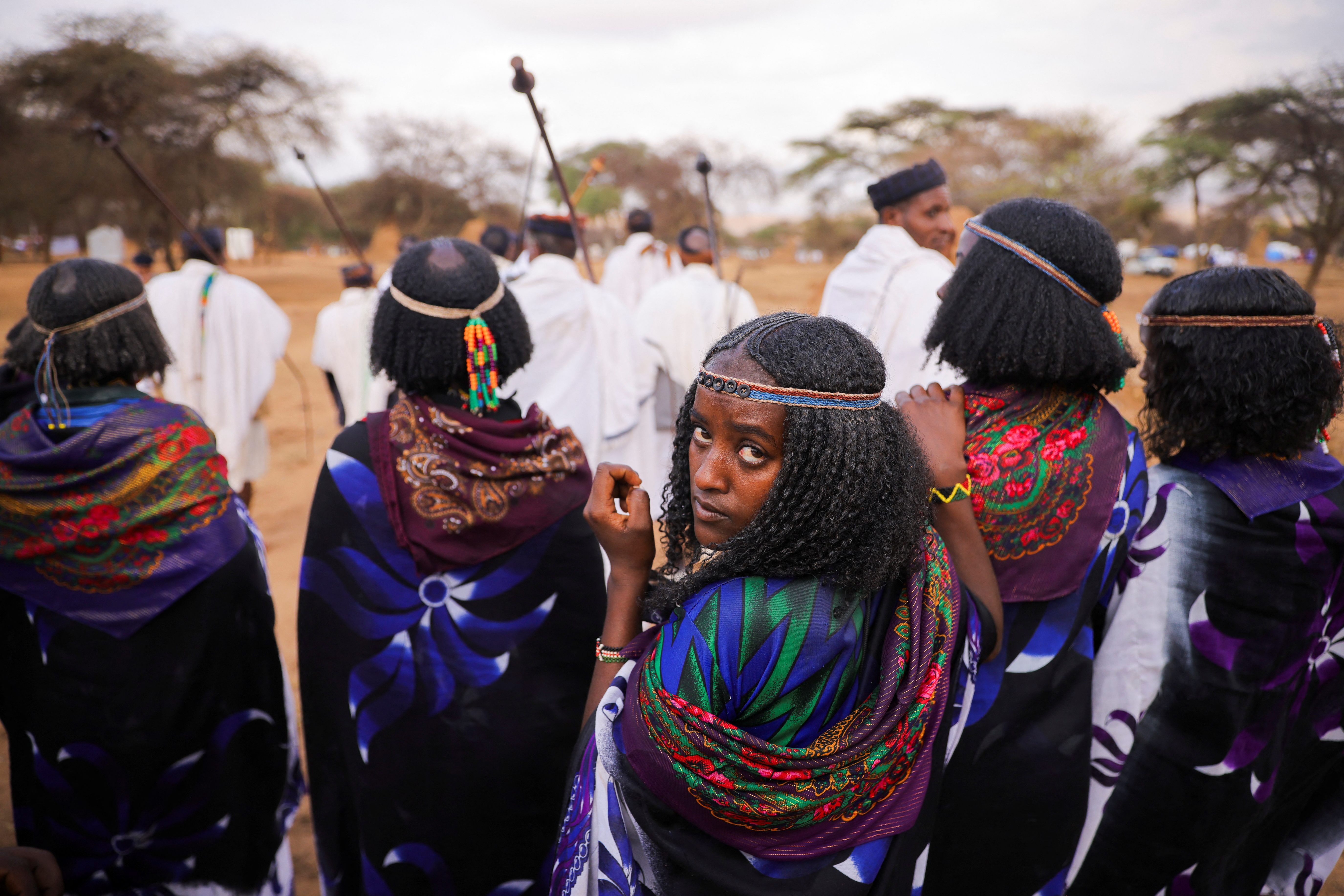 Women dressed in traditional Oromo costume attend a swearing ceremony of the newly named 72nd Borana Pastoralist chief, ‘Aba Gada’ Guyo Wariyo in Arero, Ethiopia, March 9, 2025. REUTERS/Tiksa Negeri