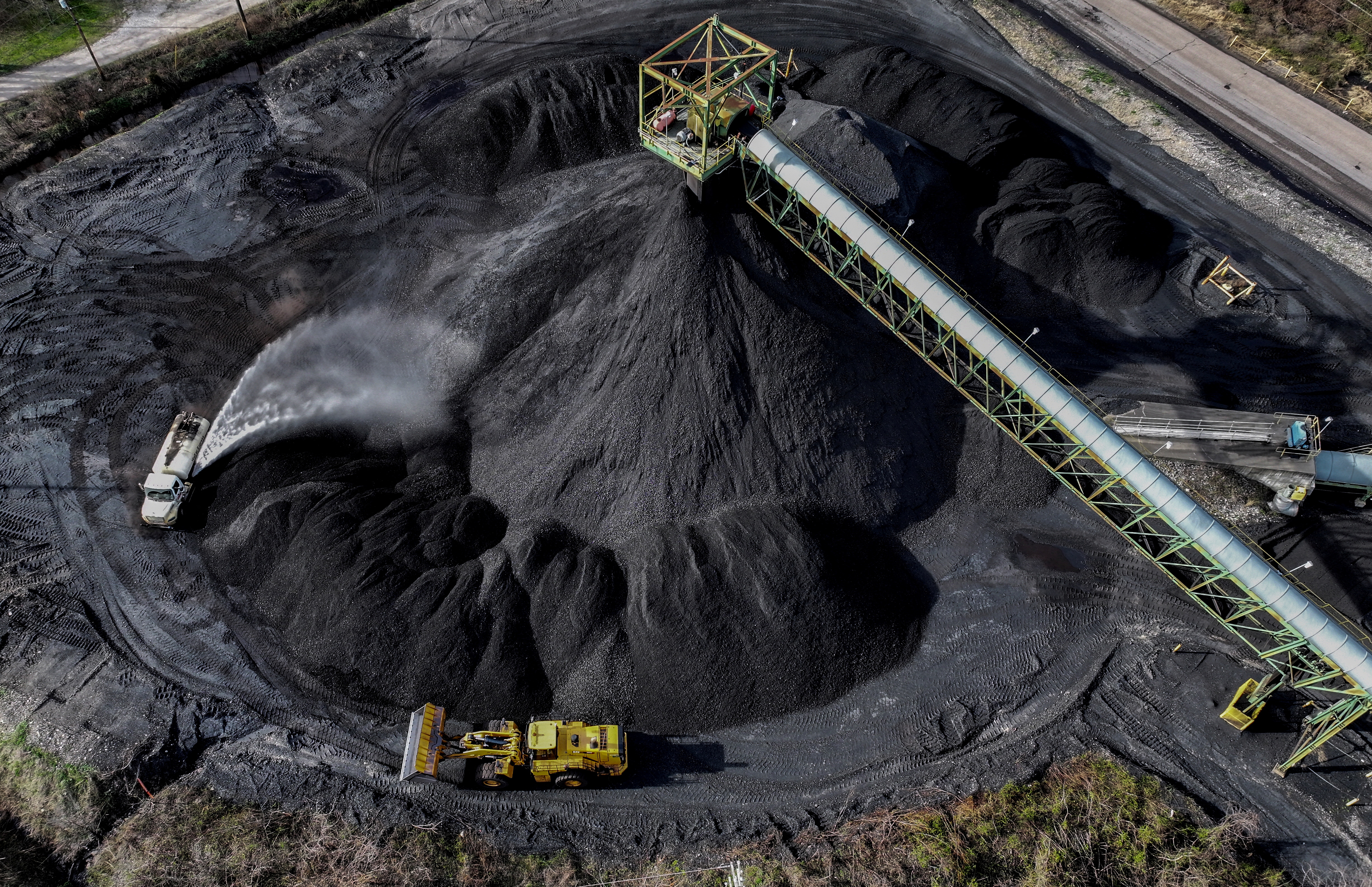 A drone view shows coal being prepared for transport, along the Kanawha river outside of Charleston, West Virginia, March 19, 2025. REUTERS/Evelyn Hockstein