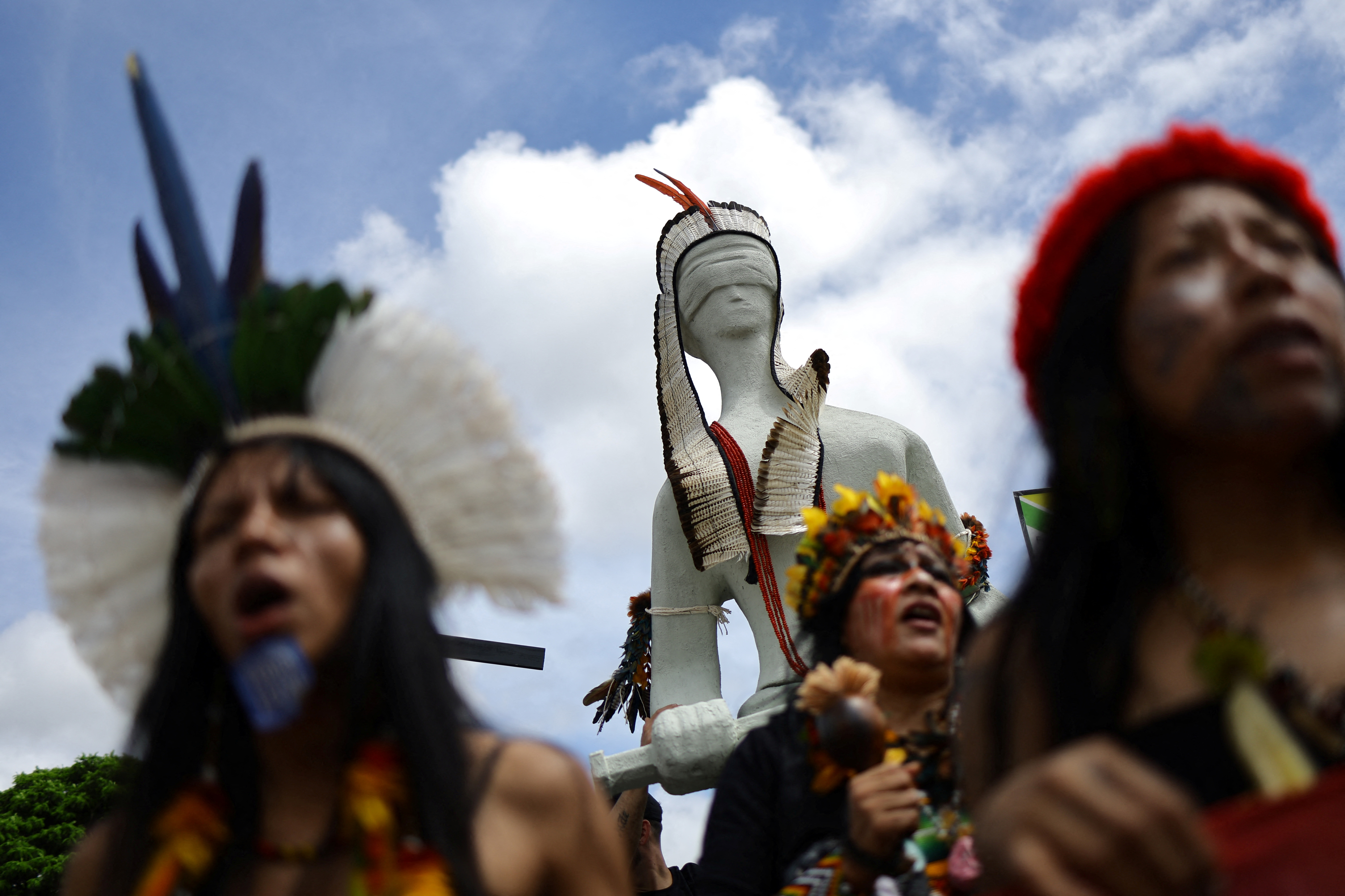 Indigenous women from Guarani-Kaiowa tribe attend the Terra Livre (Free Land) protest camp to demand the demarcation of land and to defend cultural rights, in Brasilia, Brazil April 8, 2025. REUTERS/Ueslei Marcelino