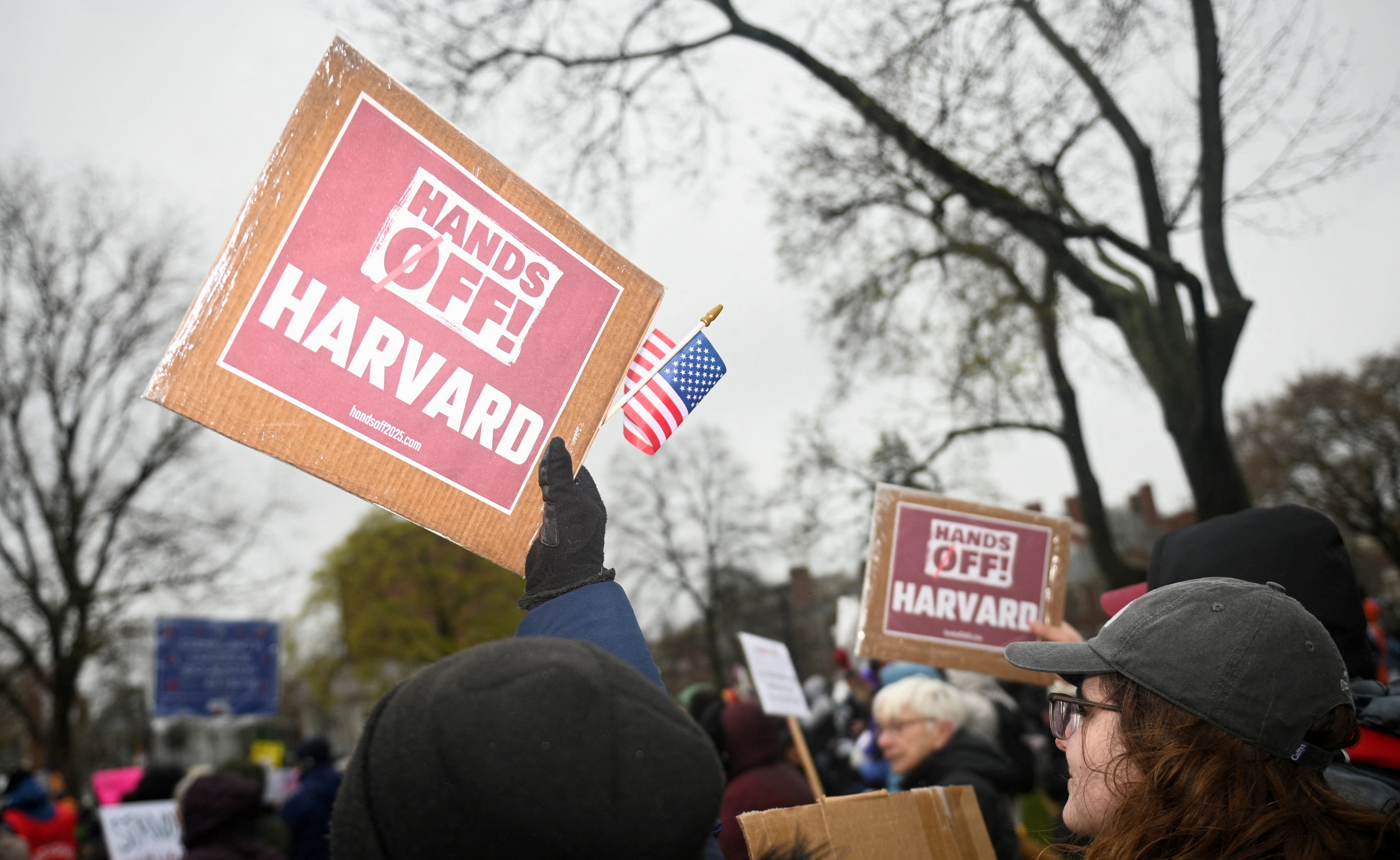 Demonstrators rally on Cambridge Common in a protest organized by the City of Cambridge calling on Harvard leadership to resist interference at the university by the federal government in Cambridge, Massachusetts, U.S. April 12, 2025. REUTERS/Nicholas Pfosi