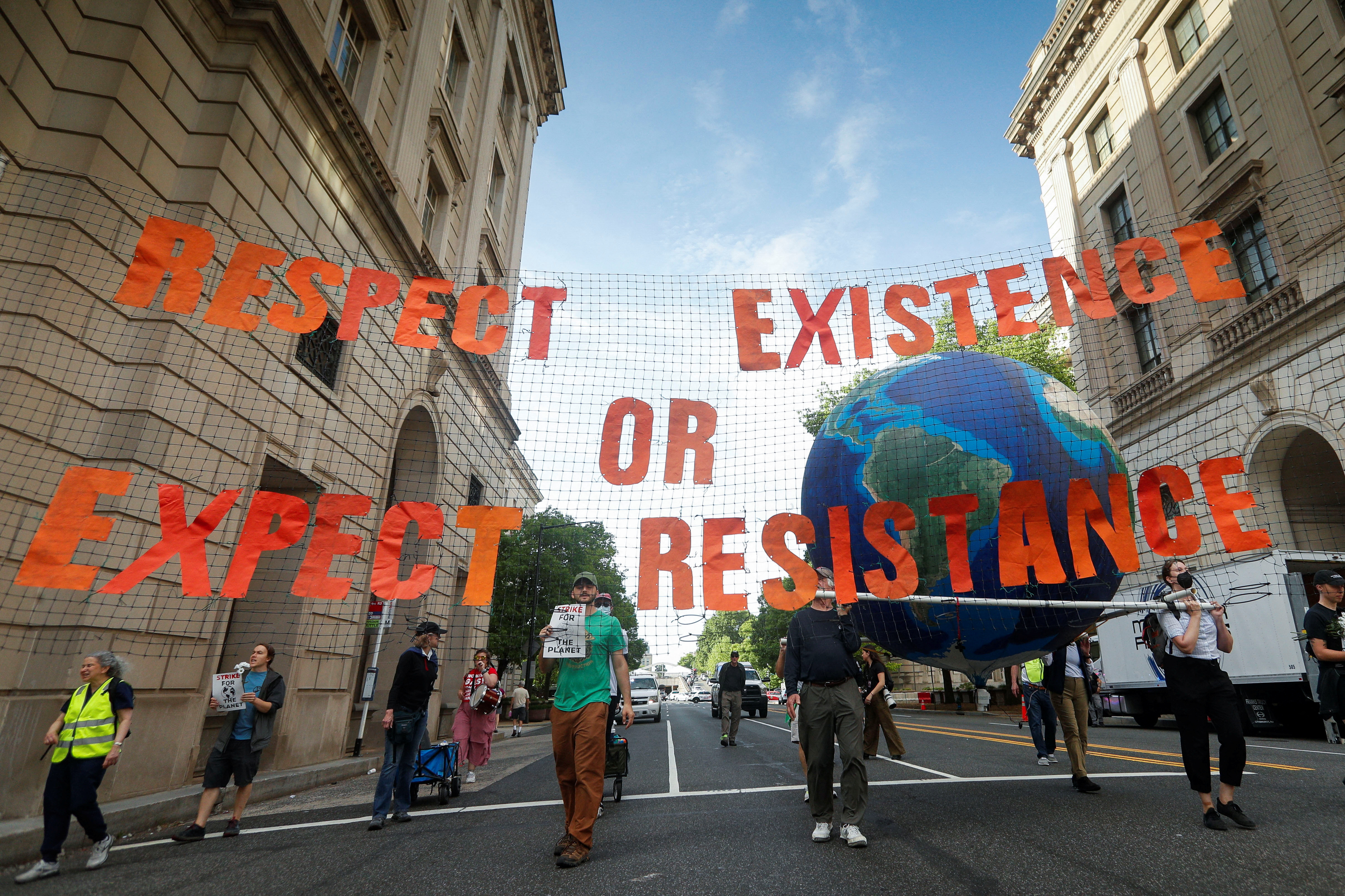 Demonstrators protest U.S. President Donald Trump's climate and environmental policies during his first 100 days in office, in Washington, D.C., U.S., April 30, 2025. REUTERS/Allison Bailey.