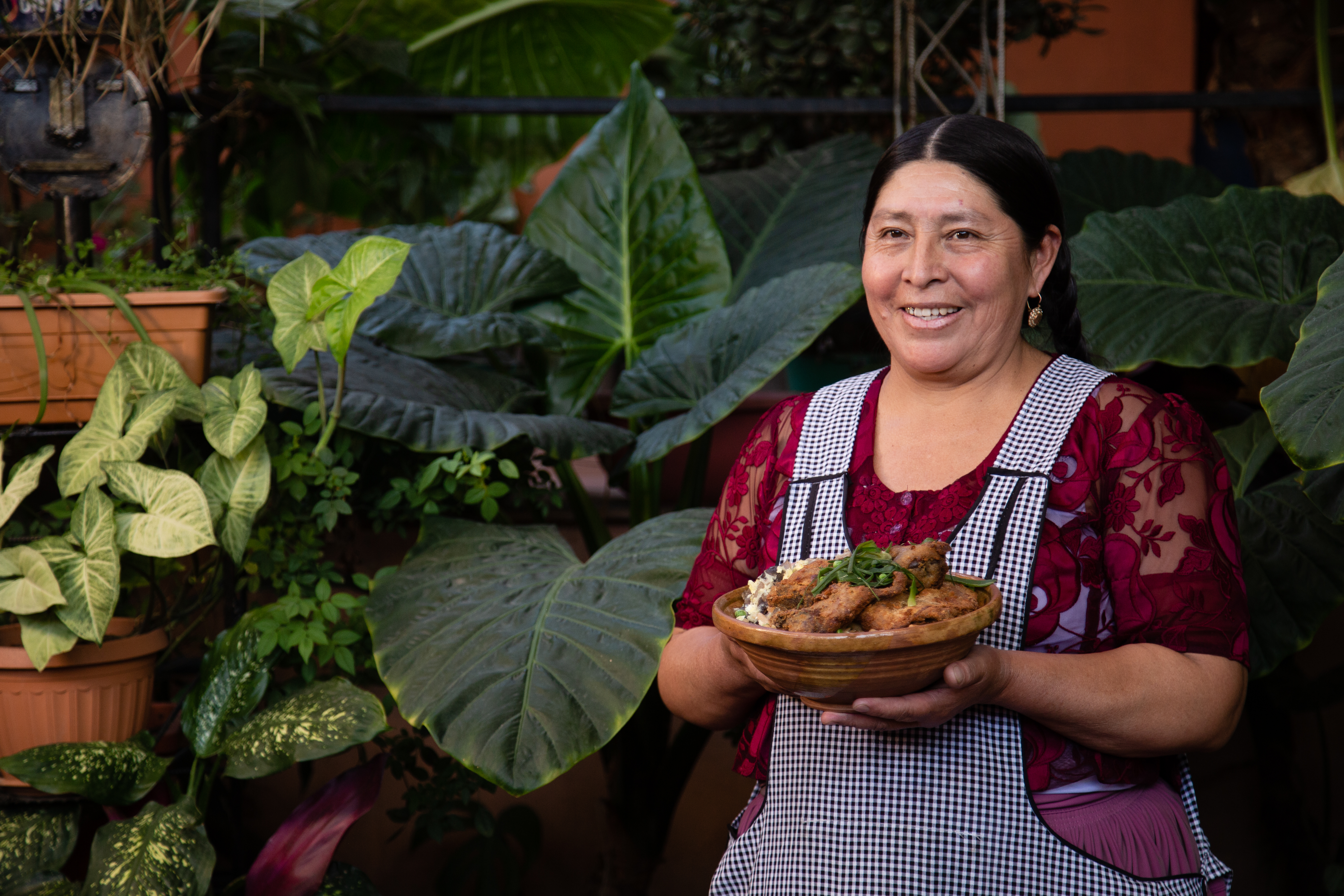 Arminda Rioja Zurita, who opened a family restaurant in Cochabamba, Bolivia using a loan from BancoSol, poses for a photograph. Accion/Handout via Thomson Reuters Foundation