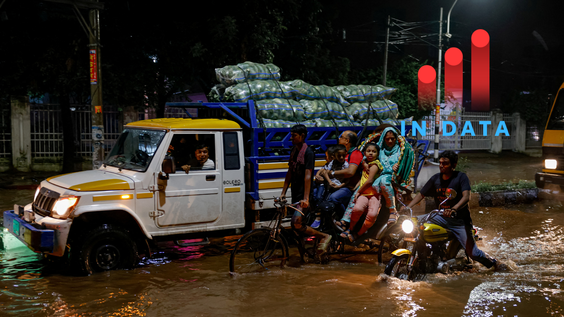 Commuters move on vehicles through a flooded road after the downpour at night in Dhaka, Bangladesh, October 2, 2024. REUTERS/Mohammad Ponir Hossain