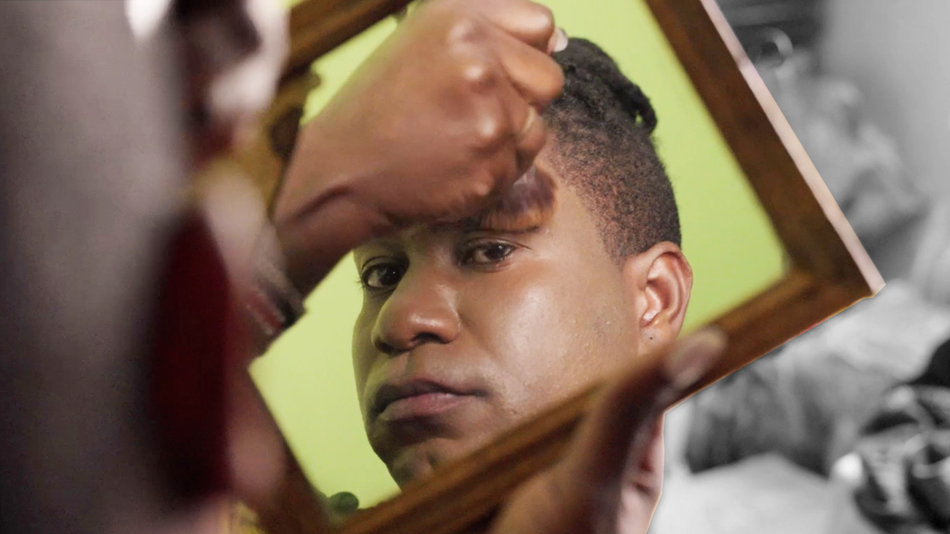 Asylum seekers looks into a mirror. Thomson Reuters Foundation
