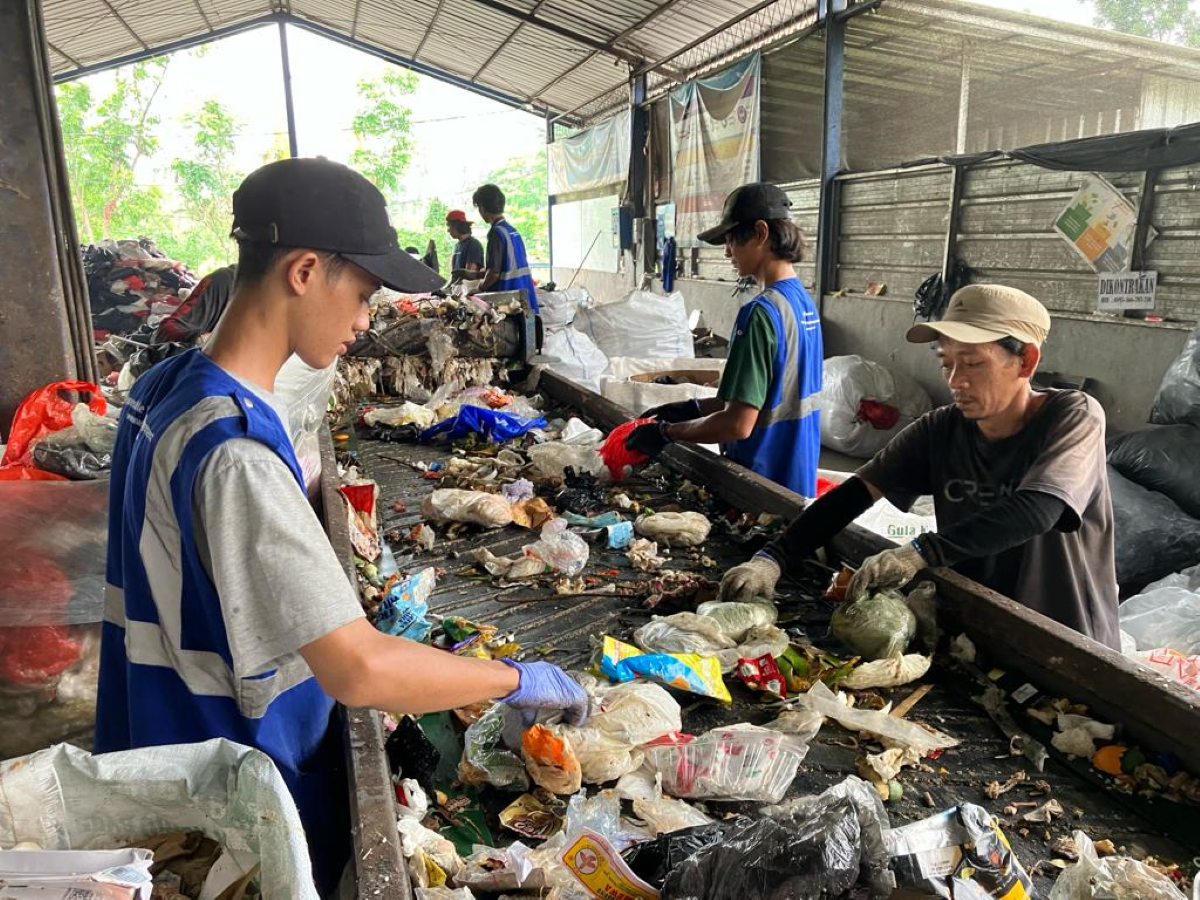 Workers sort trash at the Waste4Change recycling facility in Bekasi, Indonesia, November 24, 2023