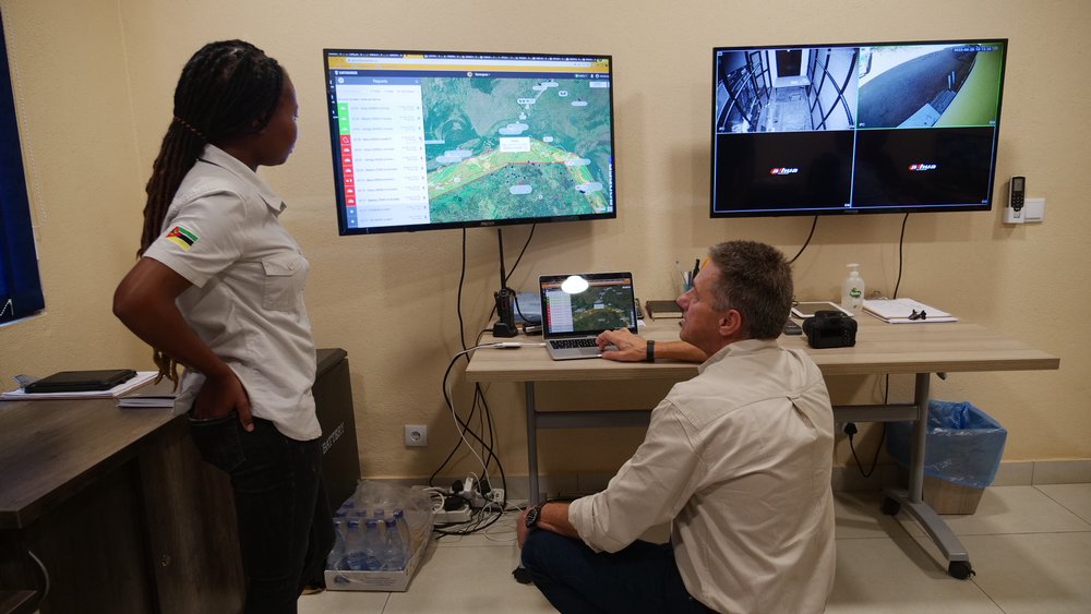 Wildlife veterinarian Mercia Angela and EarthRanger partnership manager Bruce Jones monitor the movement of threatened species on an interactive digital dashboard in Gorongosa National Park’s control room in Mozambique, May 25, 2022