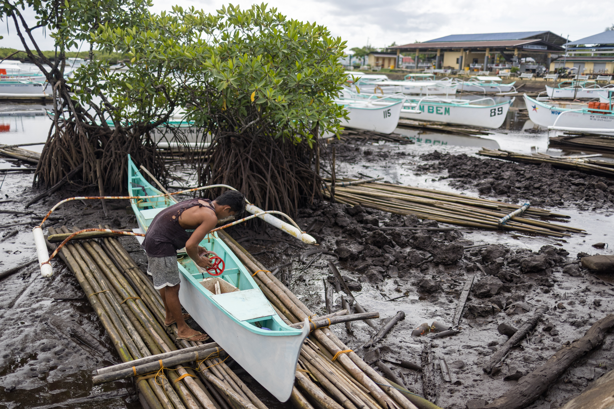 A fisherman from Del Carmen parks his boat near the mangroves. March 3, 2025. Kathleen Lei Limayo/Thomson Reuters Foundation