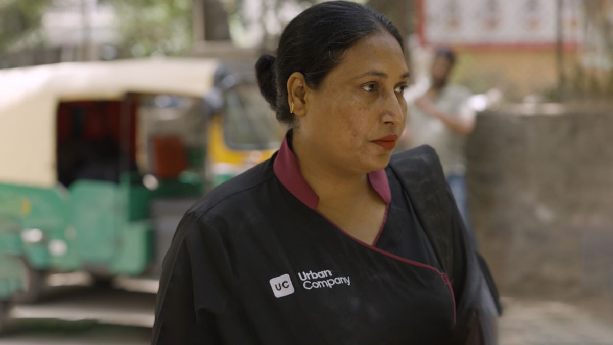 An Urban Company worker is seen in this still from Context video 'Gig workers rising: Women at India's Urban Company fight for rights'. Thomson Reuters Foundation